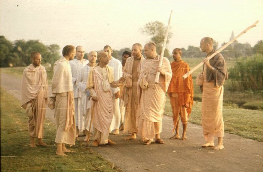 Srila Prabhupada on a morning walk with disciples
