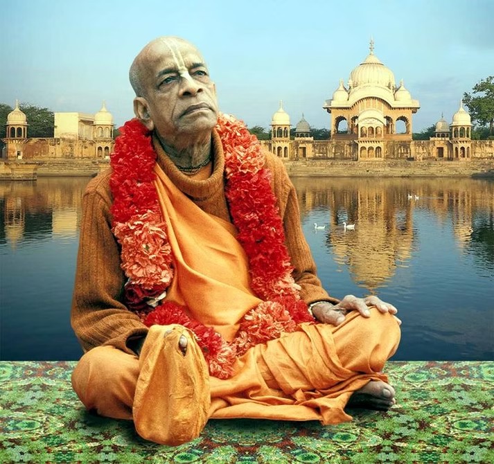 Srila Prabhupada seated in saffron robes at Kusuma Sarovara, Vrindavan